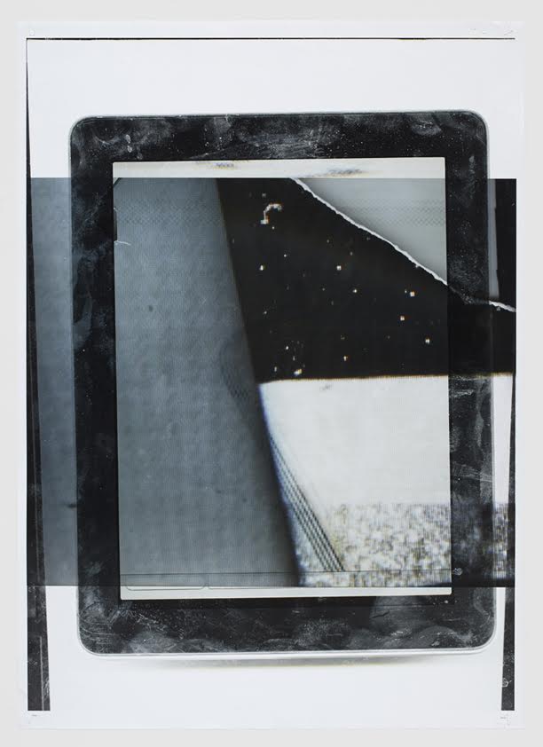 Layered tablet and printed fragments with diagonal strips across surface
